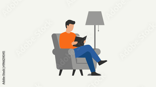 A man sitting comfortably in a grey armchair, reading a book under the light of a floor lamp, against a plain white background.
