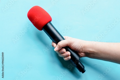 Quadro em tela Red microphone held firmly photo