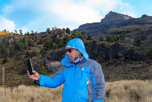 Man taking selfie on hike to iztaccihuatl volcano