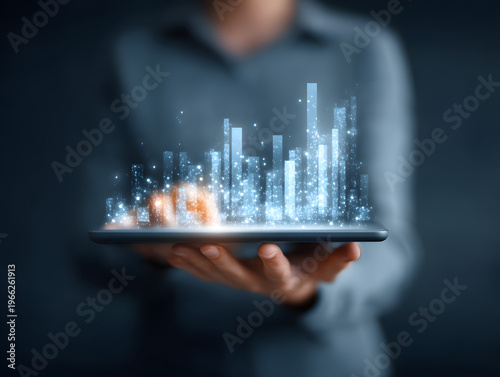 holding a digital tablet with holographic chart