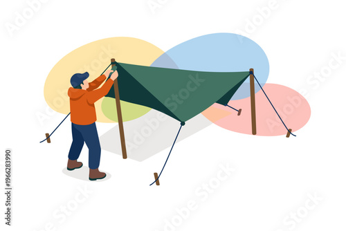 Person setting up a green tarp for camping outdoors.