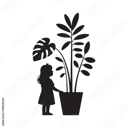Silhouette of a little girl admiring a large potted plant
