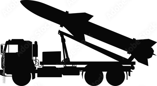 Silhouette of a large missile mounted on a military truck with a crane arm for launching operations showcasing advanced missile technology