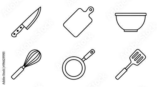 A collection of kitchen utensils on a clean surface for cooking preparation