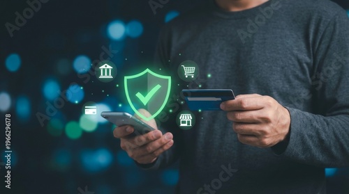 Secure online payment technology, man holding credit card and smartphone with digital shield icon