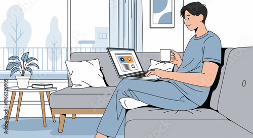 Young man in casual attire relaxing on a gray couch with a laptop and coffee cup in a modern living room with a city view.
