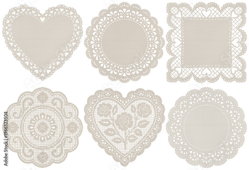 Fotografija A charming collection of six beige lace doilies in various shapes and intricate patterns, isolated