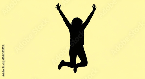 Silhouette of a person jumping with arms raised in celebration.