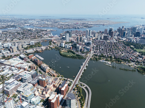 Aerial view of Boston Harbor marina with sailboats, waterfront skyline and cityscape on a sunny day. g.