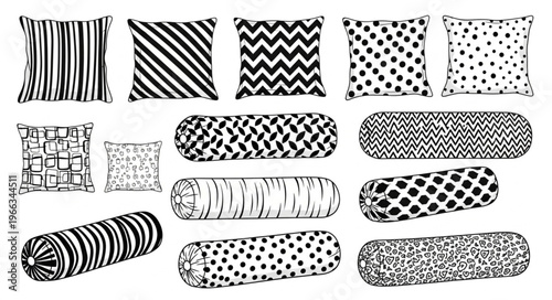 Assorted Decorative Pillows and Bolsters with Various Black and White Patterns.