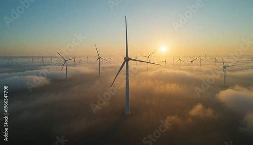 A serene landscape of wind turbines above the clouds at sunrise