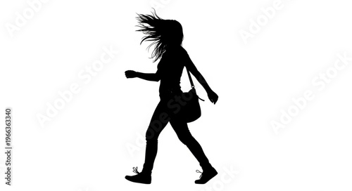Silhouette of a woman walking with windblown hair and a shoulder bag.
