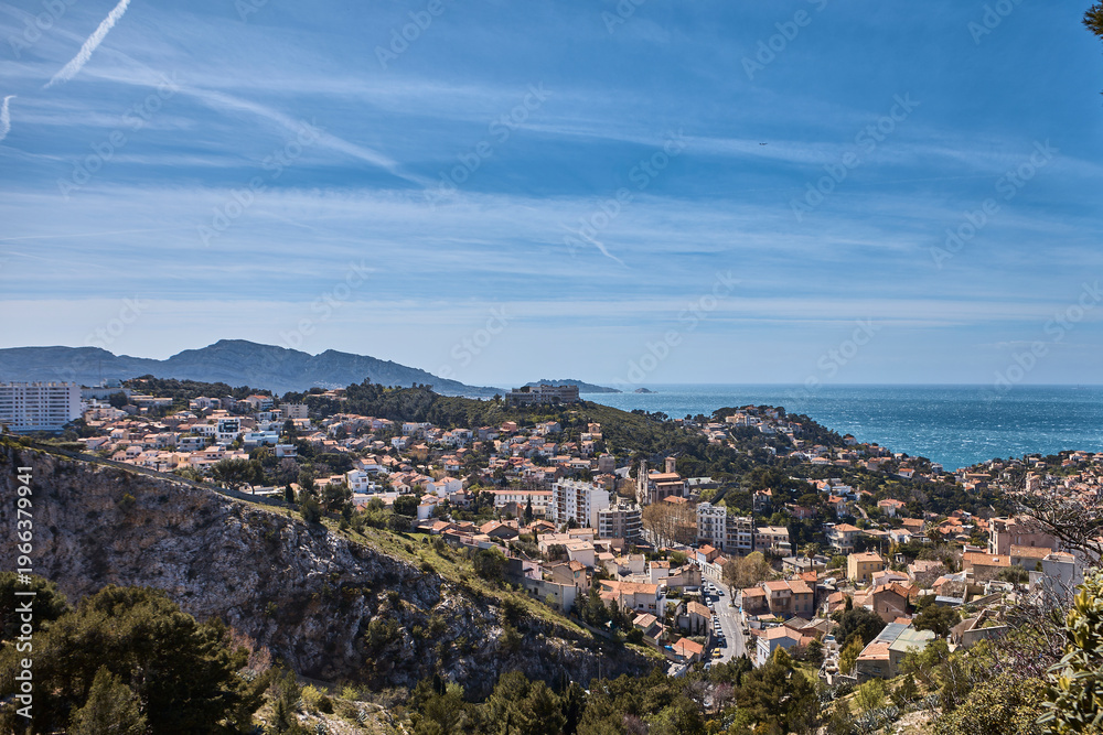 Fototapeta premium Panoramic waterfront view of Marseille with harbor, hills and dense urban fabric