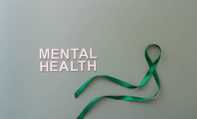 Mental health text with green awareness ribbon