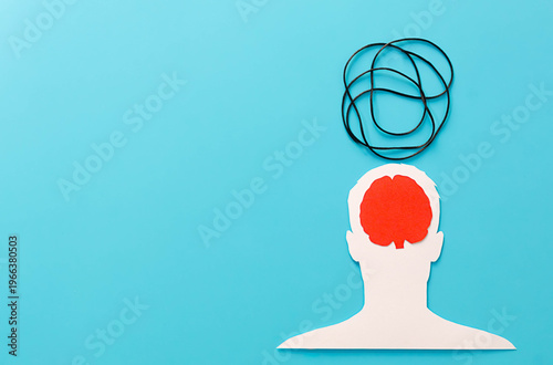Human head cutout experiencing mental health issues and anxiety