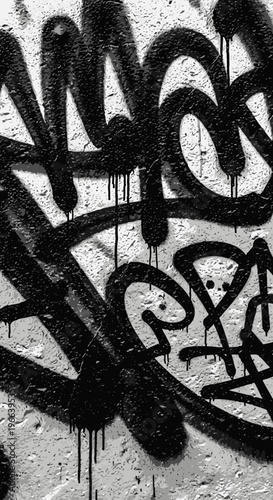 Graffiti Art on Textured Wall - Black Spray Paint Drips on Concrete