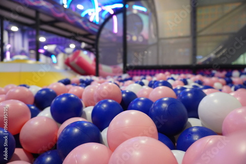 Closeup of colorful plastic balls in a childrens ball pit at an indoor playground