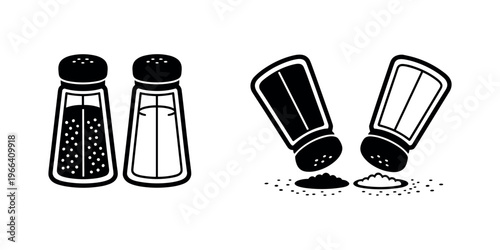 Salt and pepper shakers spilling seasonings spices in white background