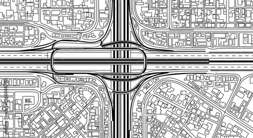 Aerial View of Complex Highway Interchange and Cityscape.