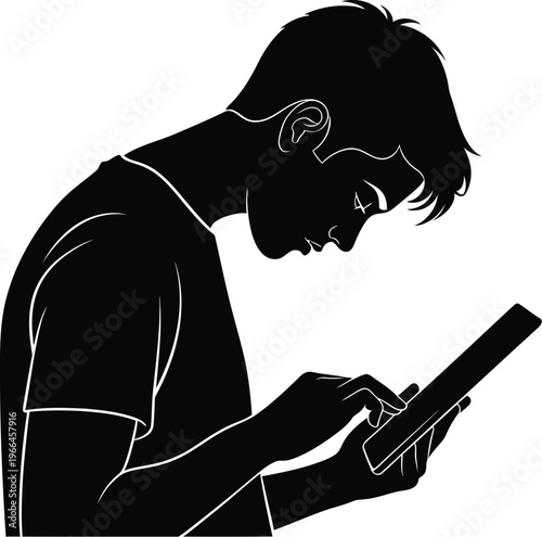 Silhouette of a young person using a digital tablet