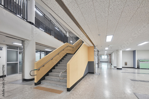 Картината върху платно Wide corridor and staircase in clean modern school building