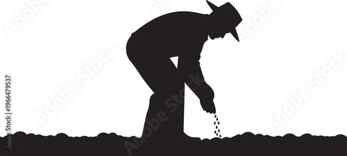 Man planting seeds in the soil with a hat