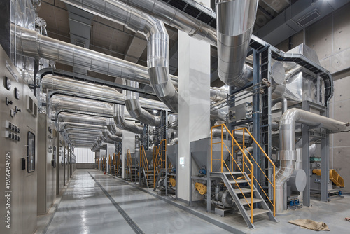 Bright plant room with large ducts and technical infrastructure