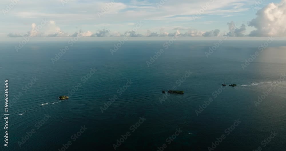 custom made wallpaper toronto digitalTwo small rocky islands rise from the calm ocean surface. Siargao, Philippines.