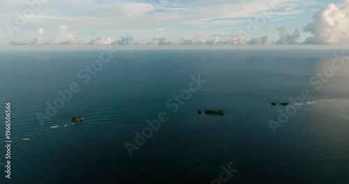 Wallpaper Mural Two small rocky islands rise from the calm ocean surface. Siargao, Philippines. Torontodigital.ca