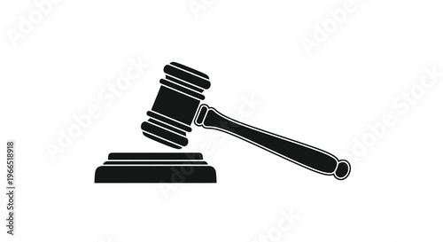 A black silhouette of a gavel resting on a sound block