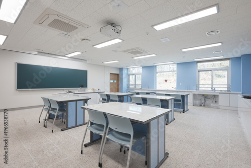 Science classroom with teacher board and lab tables in modern school