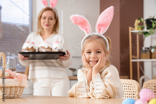 Happy little daughter and m...