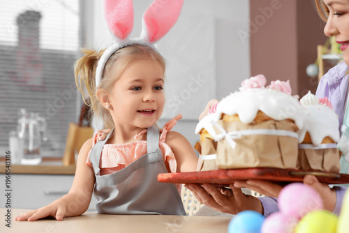 Happy little daughter and m...