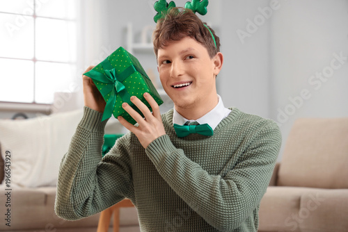 Redhead young man with gift...