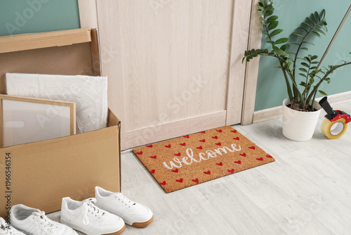 Doormat and cardboard box w...