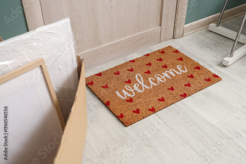 Doormat with cardboard box ...