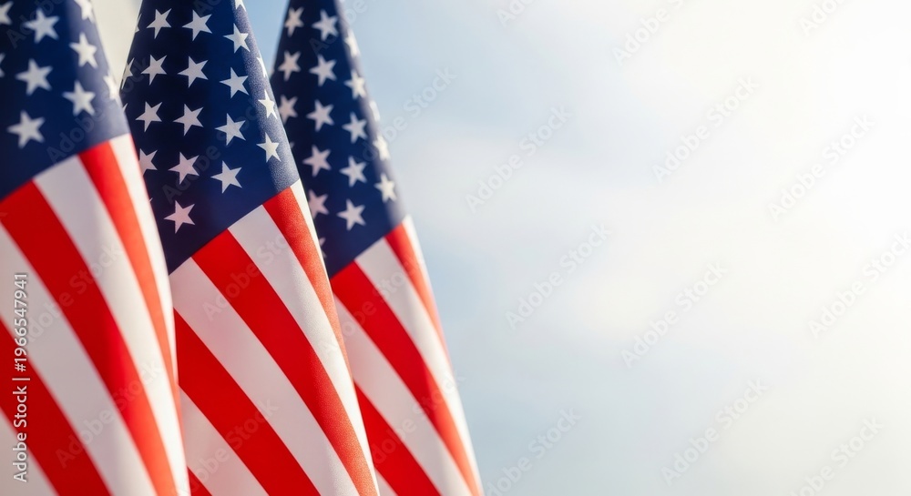 Obraz premium Patriotic display a close up of waving american flags against a bright sky
