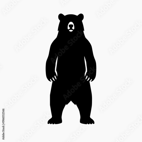 A striking silhouette of a large bear standing on its hind legs