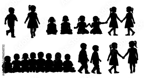 Children walk and sit in groups holding hands outdoors