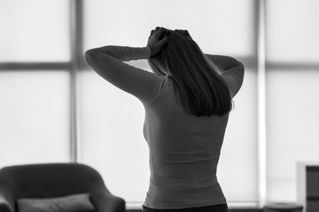 Silhouette of angry mature woman at home, back view. International Stress Awareness Week