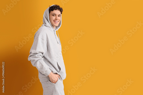 Young man in grey sports su...