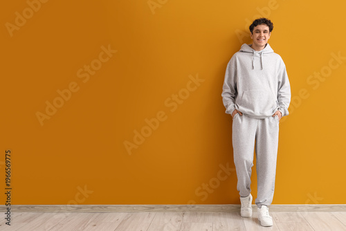Young man in grey sports su...