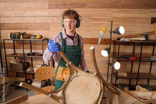 Young carpenter assembling ...