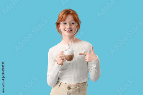 Teenage redhead girl pointi...