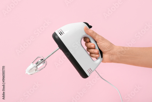 Female hand with electric m...