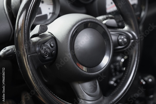 View of black steering whee...