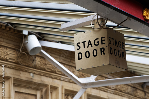 Stage door sign on theater exterior building
