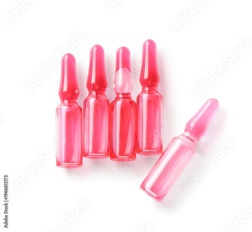 Ampules with red liquid on ...