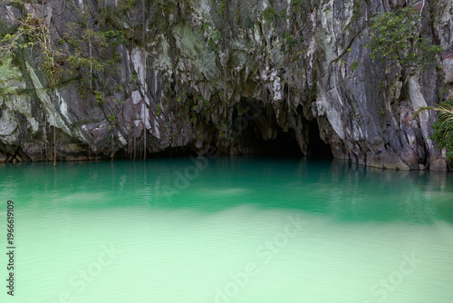 Entrance to underground river cave with emerald water in Puerto Princesa, Palawan Philippines