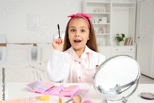 Surprised little girl with ...